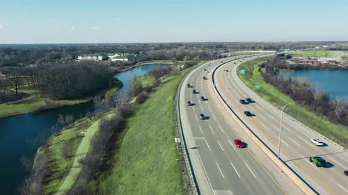 Flight Over the Highway and Car Traffic Moving in the Direction of the Big City