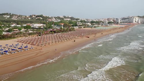 Aerial view of amazing beach with colorful umbrellas