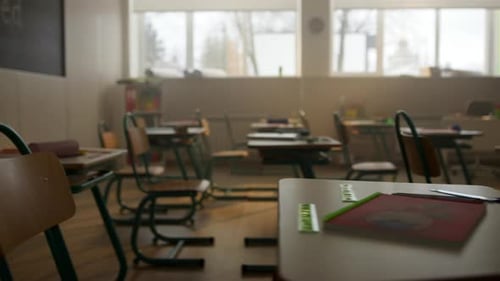 Empty Classroom with Desks and Chairs