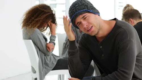 Crying Man During Group Therapy Session