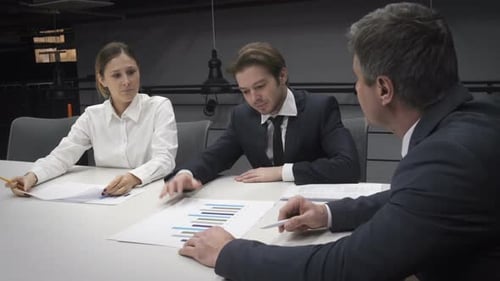Business Professionals Meeting in Modern Office, Signing Agreement