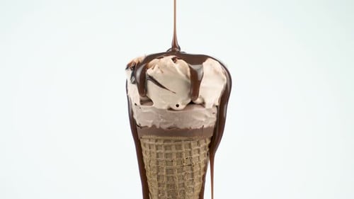 Pouring Liquid Chocolate On Ice Cream