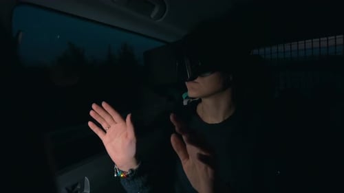 Woman using VR-headset in the car