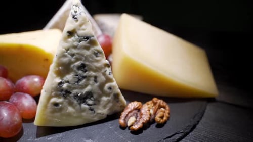 Cheese Board with Grapes and Walnuts Close Up
