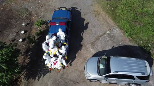 Team in Suits Rides Truck Through Rural Landscape