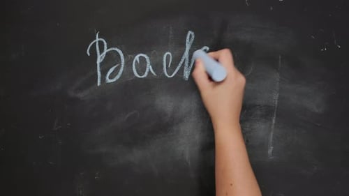 female hand holds blue chalk