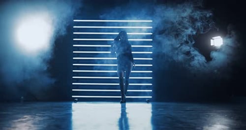 Attractive Girl Dancing Seductively in Tubers of Smoke