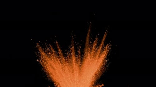 Orange powder exploding on black background in super slow motion, shot with Phantom Flex 4K