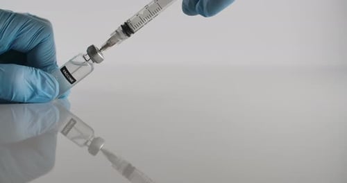 Vaccine being drawn into syringe in laboratory
