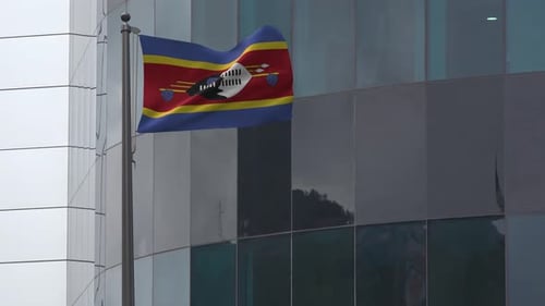 Eswatini National Flag Waving Animation on Modern Building