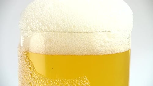 Pouring Golden Beer Into Glass Close-Up