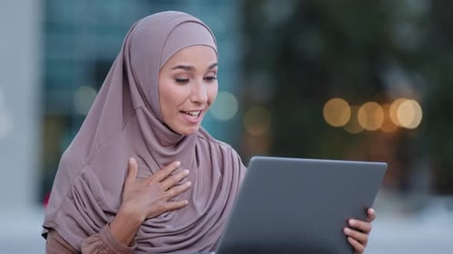 Woman Smiling During Video Call Outside