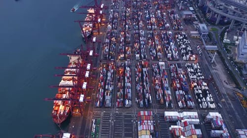 Aerial top view of container in logistics or shipping business at Victoria Harbour, Hong Kong.