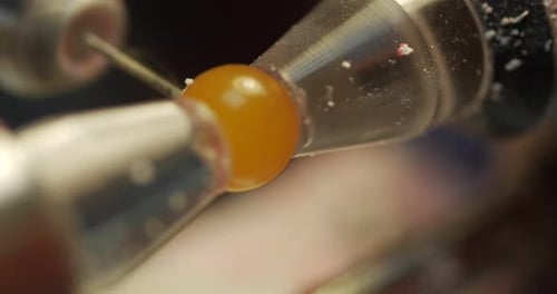 Macro Carving of Yellow Sphere with Precision Tool