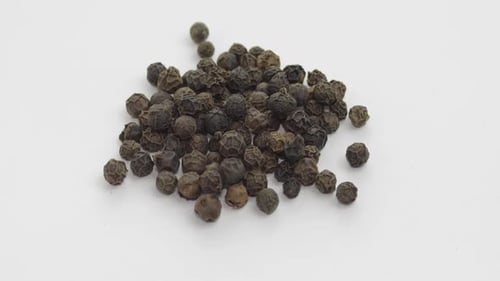 Pile of Black Peppercorns Rotating Close Up