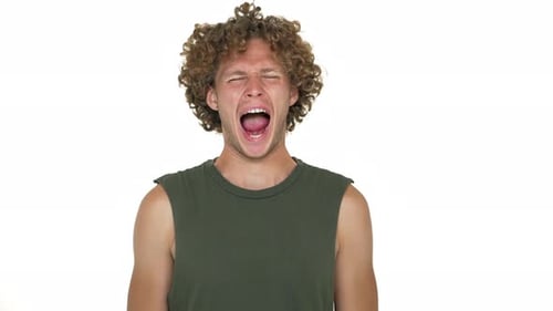 Caucasian Curly Guy in Green Muscle Shirt Doing Speech Therapy Articulating Isolated Over White