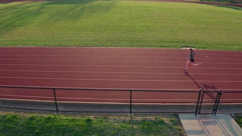 Woman Jogging on a Track, Aerial Shot