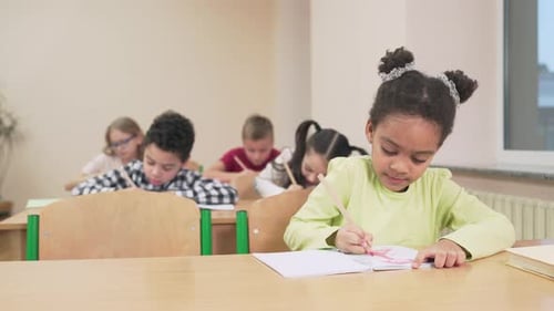 Children Studying and Drawing at School Classroom