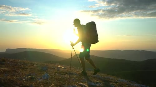 Man Hiking on Mountain at Golden Hour