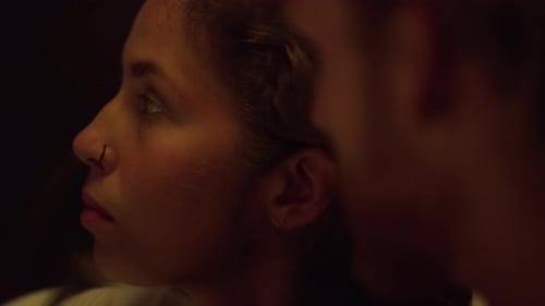 Young Woman Applying Lipstick at Vanity