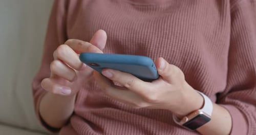 Close up of hands using smartphone