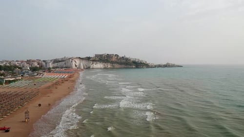 Aerial view of amazing beach with colorful umbrellas