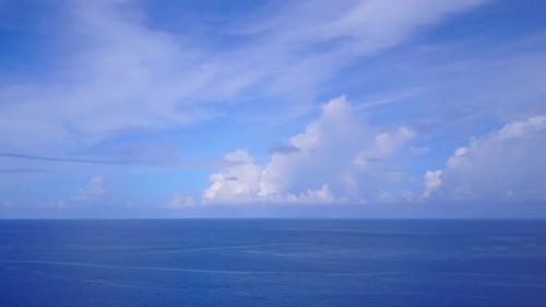 Drone seascape of coast beach voyage by blue water with sand background