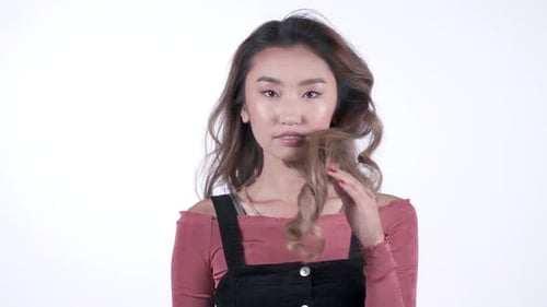 Beautiful Young Woman Posing in Fashion Overalls