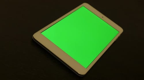 Green screen tablet PC display on wooden surface slow panning 4K 3840X2160 UHD video - Modern table