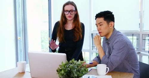 Office Collaboration with Laptop in Modern Workplace