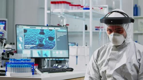 Scientist in Protective Suit in Bright Lab Setting