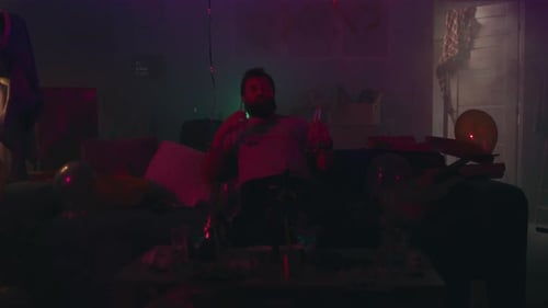 Bearded Man Drinking Alcohol During Party