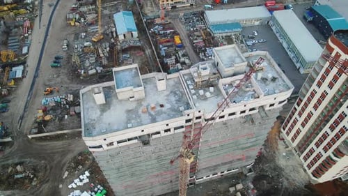 Aerial view to the construction works on the top of building