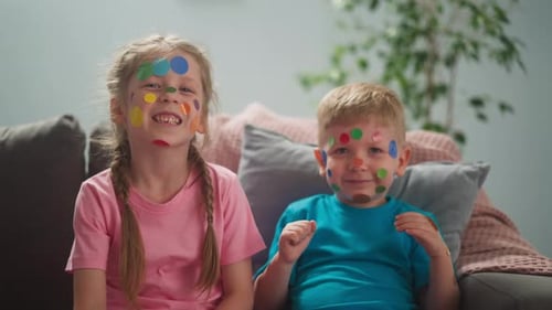 Smiling Children with Colorful Stickers on their Faces