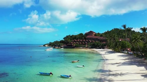 Aerial top view scenery of exotic resort beach voyage by aqua blue sea with white sandy background o