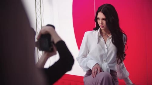 Beautiful Woman Posing for Photographer in Studio