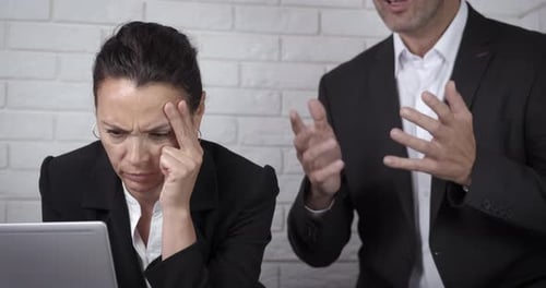 Corporate Conflict: Woman Receiving Criticism in the Workplace
