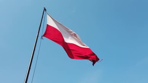 Polish Flag, Wind and Blue Sky.