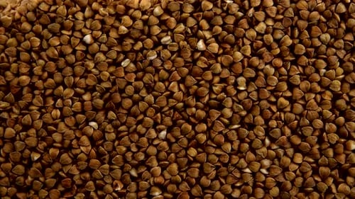 Buckwheat Grains Pouring and Forming a Mound