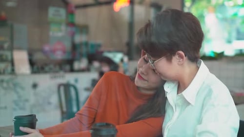 Women Embracing in Cafe, Loving Relationship