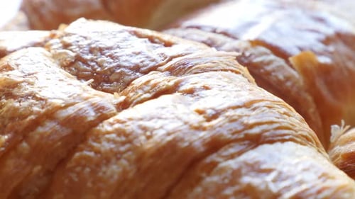 Famous French croissants Vienna-style pastry rolls made of dough slow tilt 4K 2160p 30fps UltraHD f