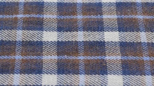 The texture of the cotton fabric in squares. The structure of the fabric. Fashion. Style. Square pat