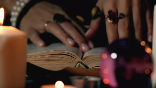 Open Book and Candles in Dark, Mystical Setting