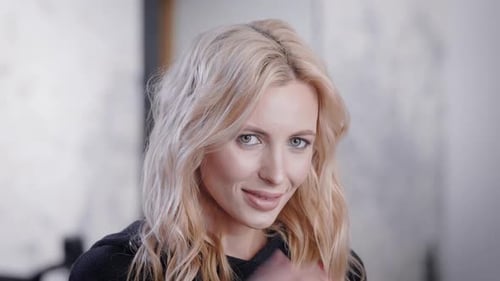 Attractive Blonde Woman Smiling and Posing