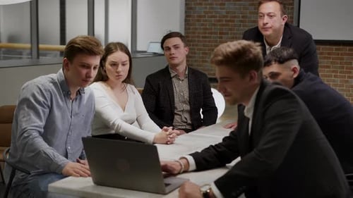 Business Meeting with Young Adults in Modern Office