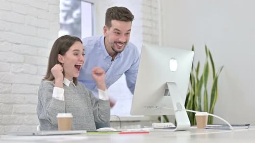 Colleagues Celebrate Success in Modern Office