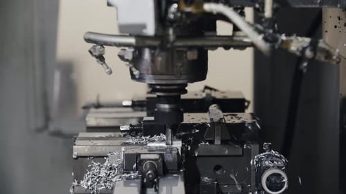 Automated Cnc Turning Lathe Machine Cutting Metal Part at Factory