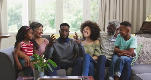 Multi-Generational Family Relaxing Together on Sofa