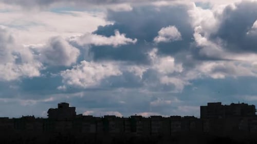 Moving Clouds Time-Lapse Over Cityscape