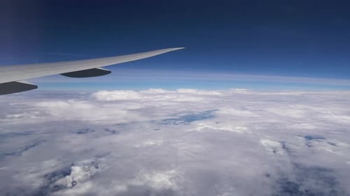 Airplane View of Blue Sky and White Clouds